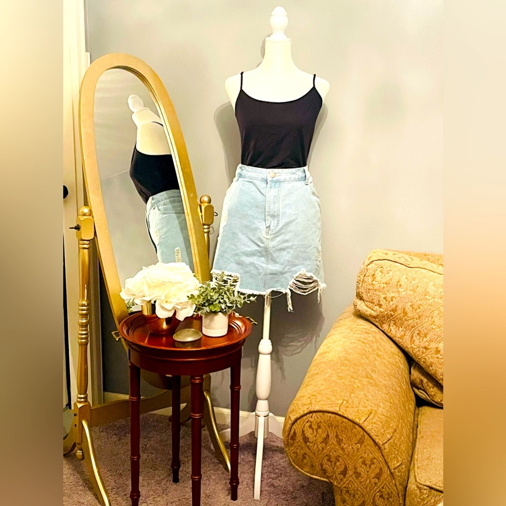 Distressed light denim mini skirt